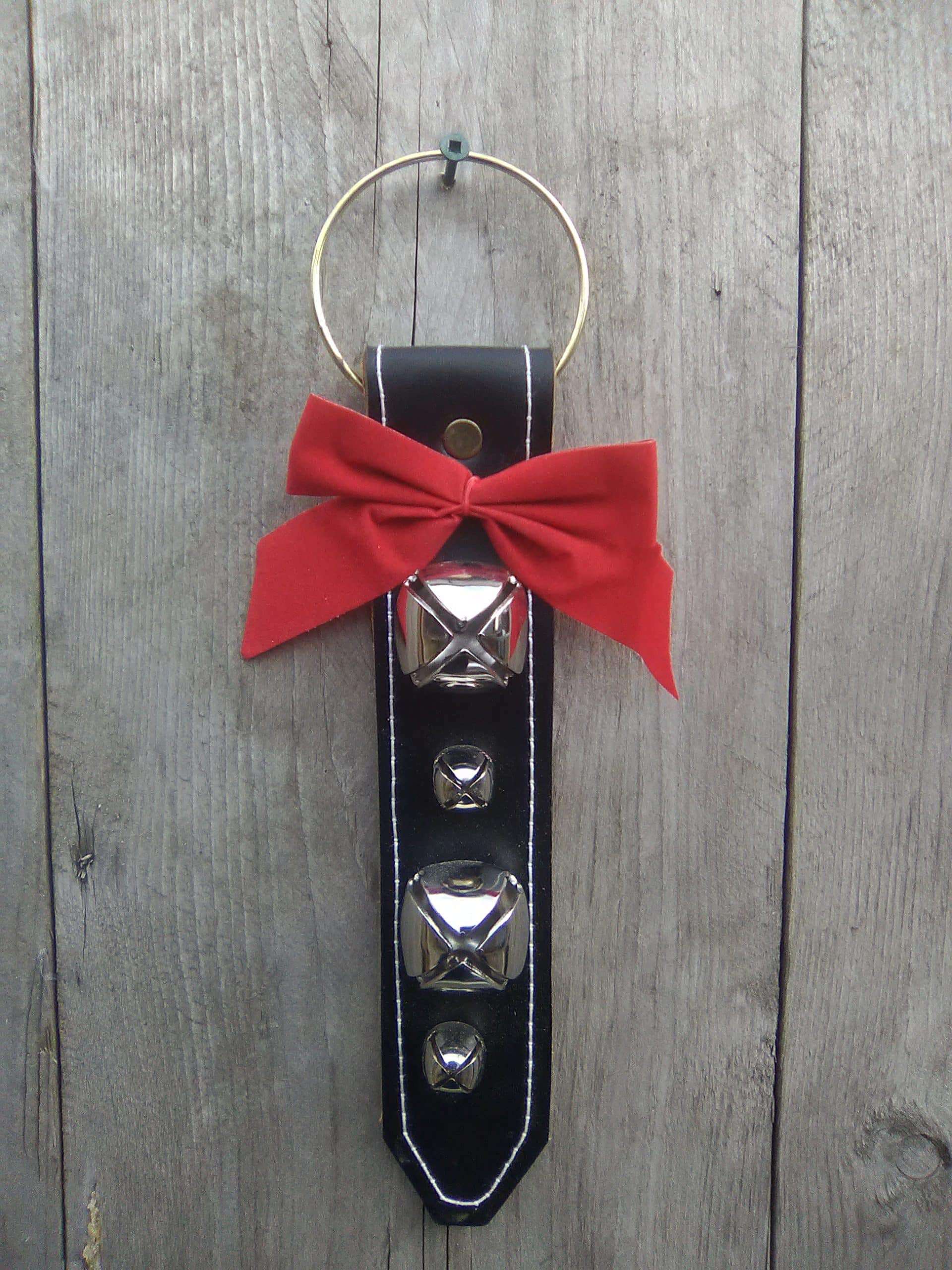 Door hanger with 4 large and small brass plated bells - black leather