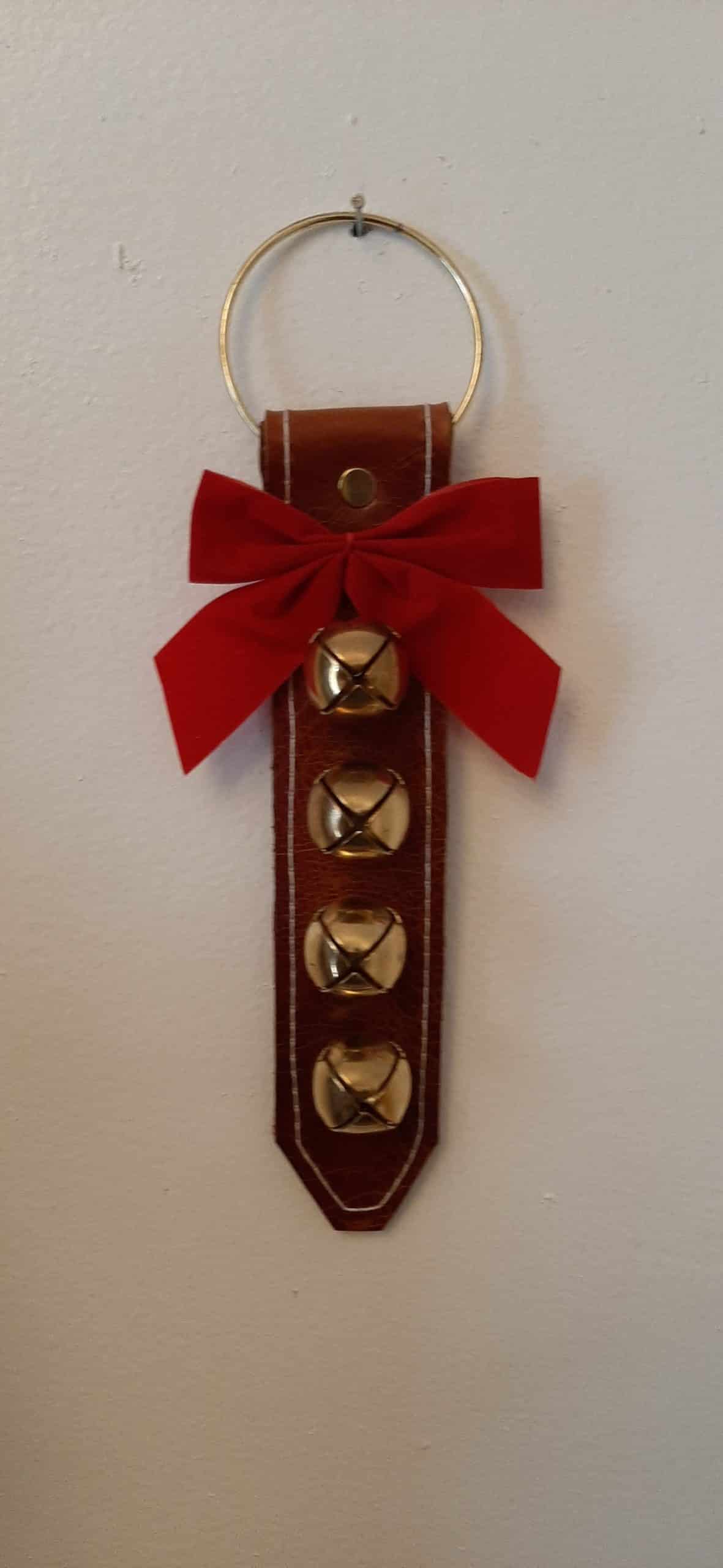 Door hanger with 4 small brass plated bells - brown leather