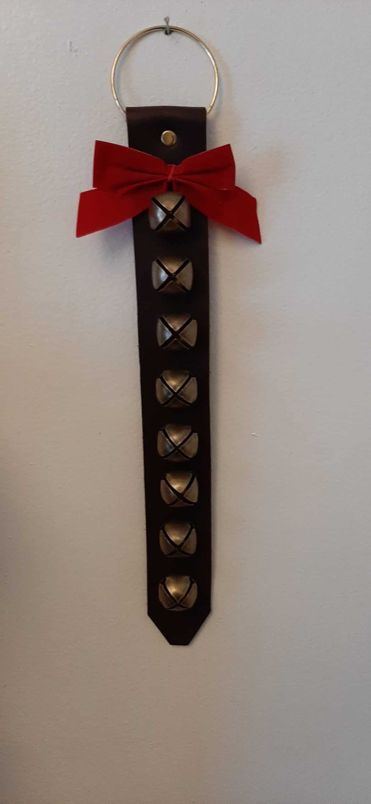 Door hanger with 8 small brass plated bells -  brown leather