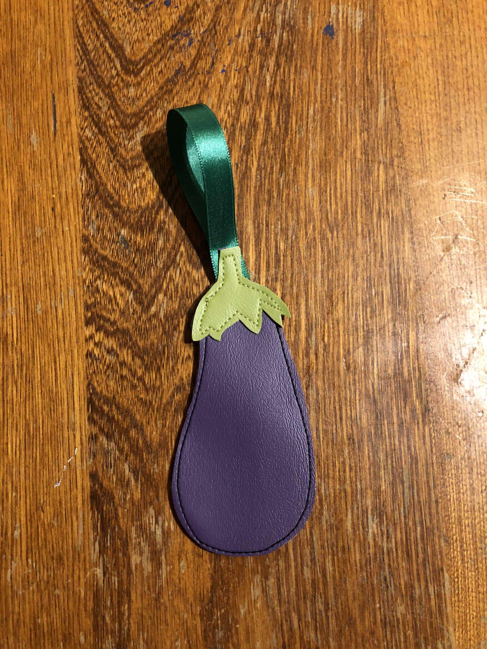Upcycled ornament, freehand stitched exclusively from costume shop scraps. Eggplant Ornament