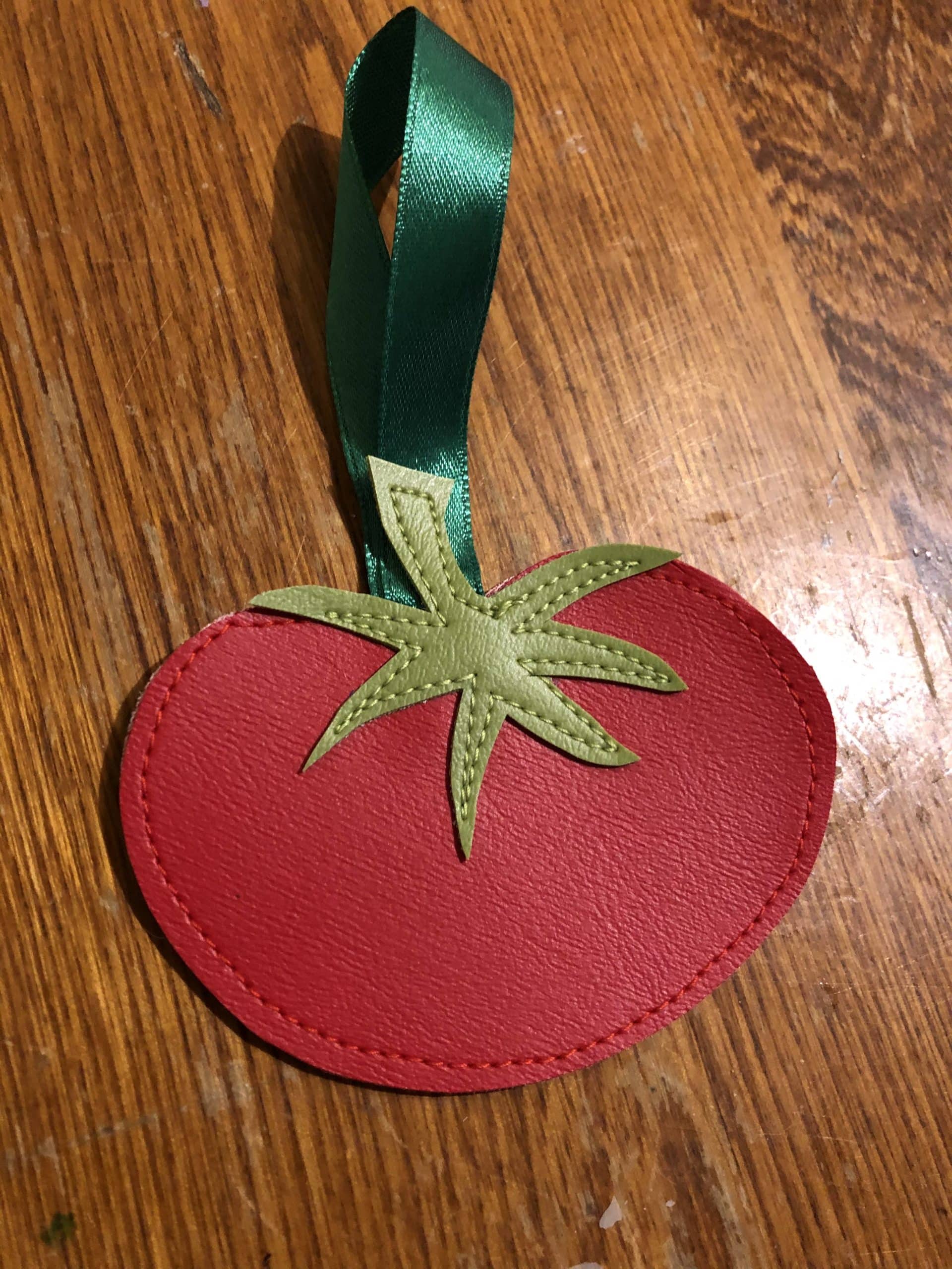 Upcycled ornament, freehand stitched exclusively from costume shop scraps. Field Tomato Ornament