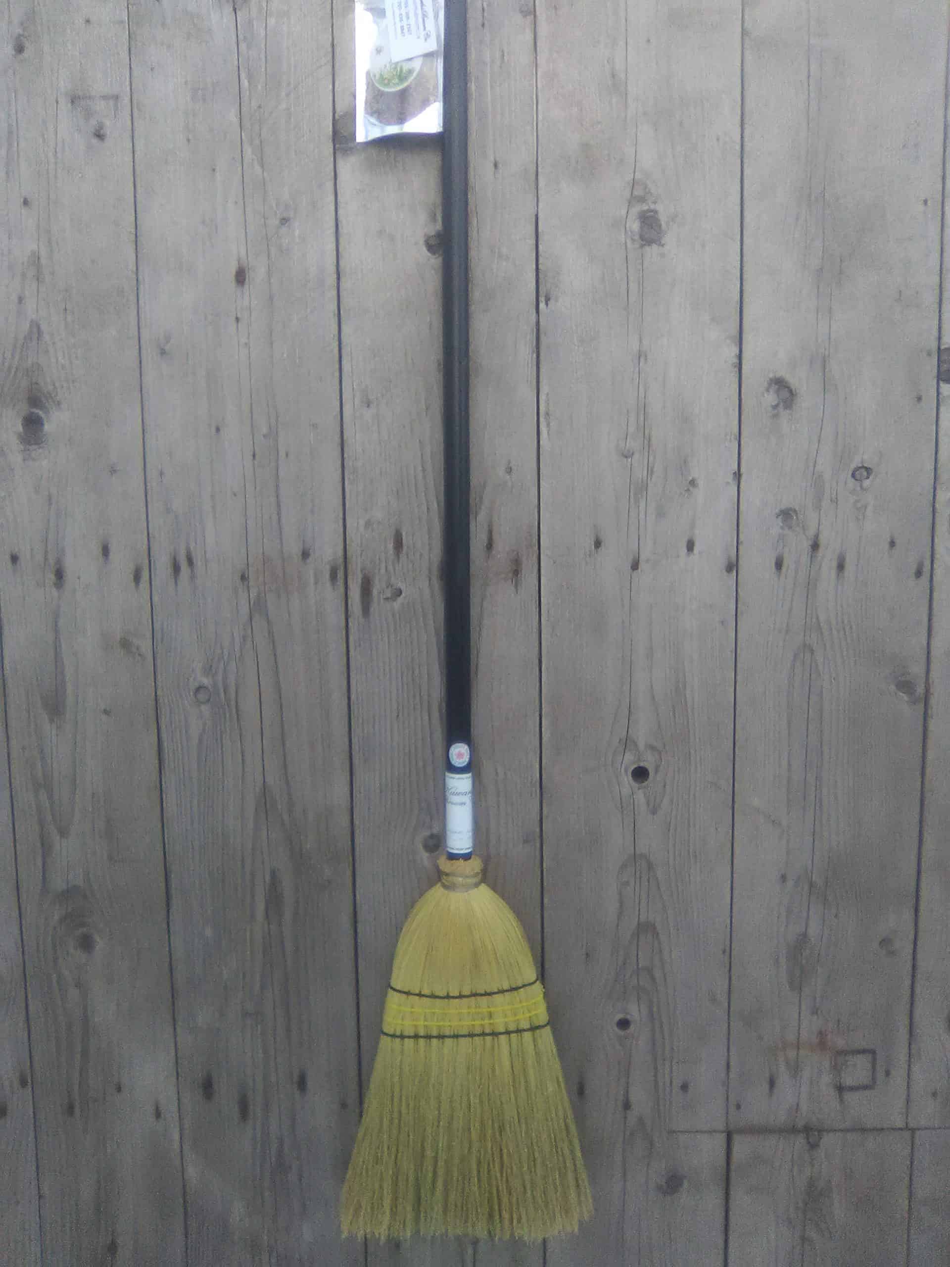 Garden broom with black handle