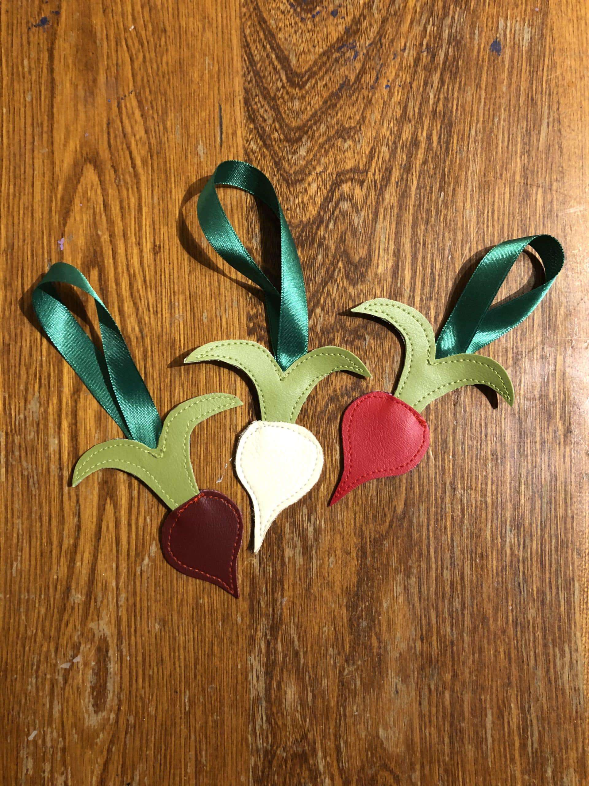 Three upcycled ornaments, freehand stitched exclusively from costume shop scraps. (3 different coloured radishes) Radish Ornament Trio