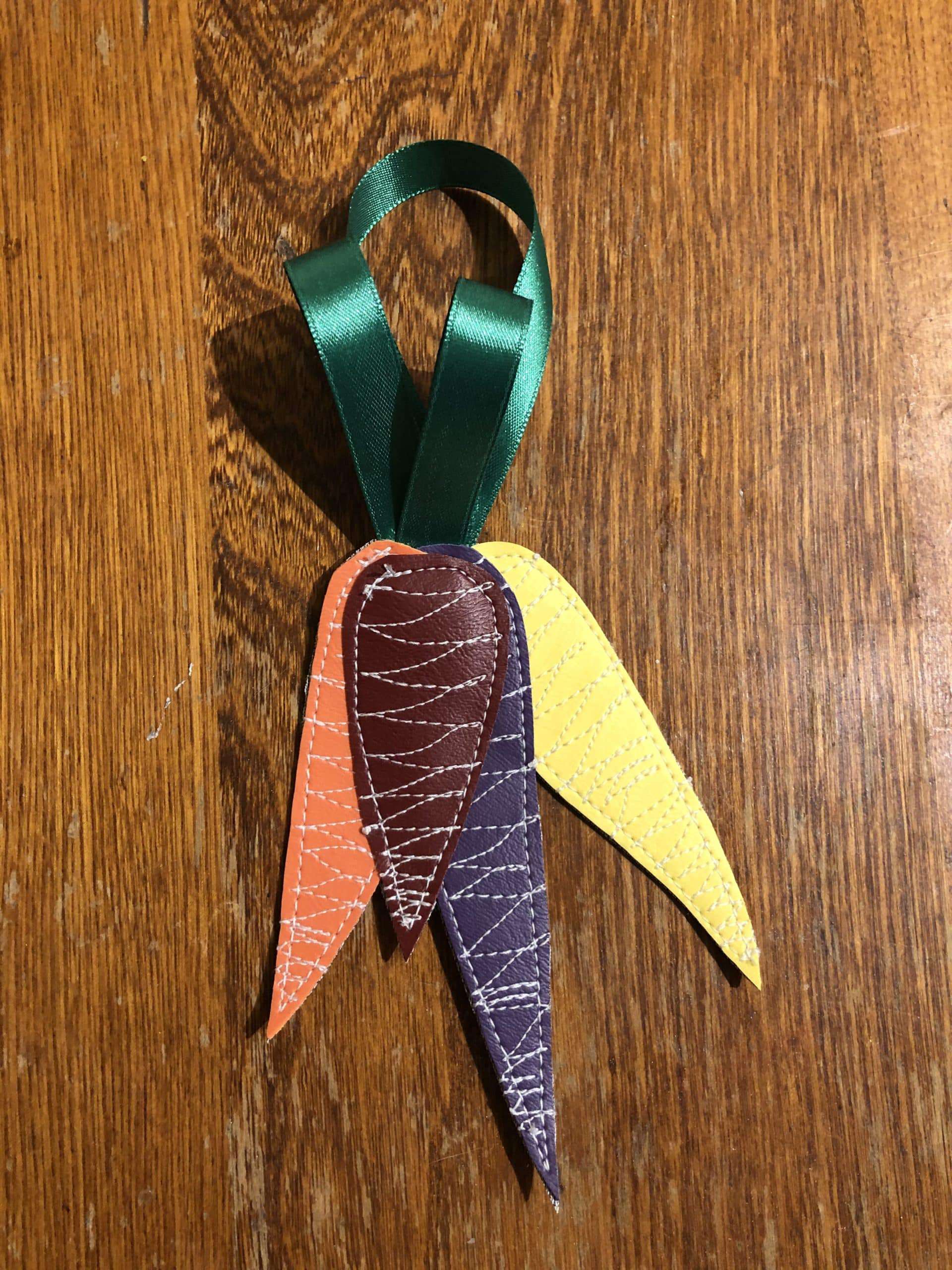 Upcycled ornament, freehand stitched exclusively from costume shop scraps. Rainbow Carrot Bunch Single Ornament