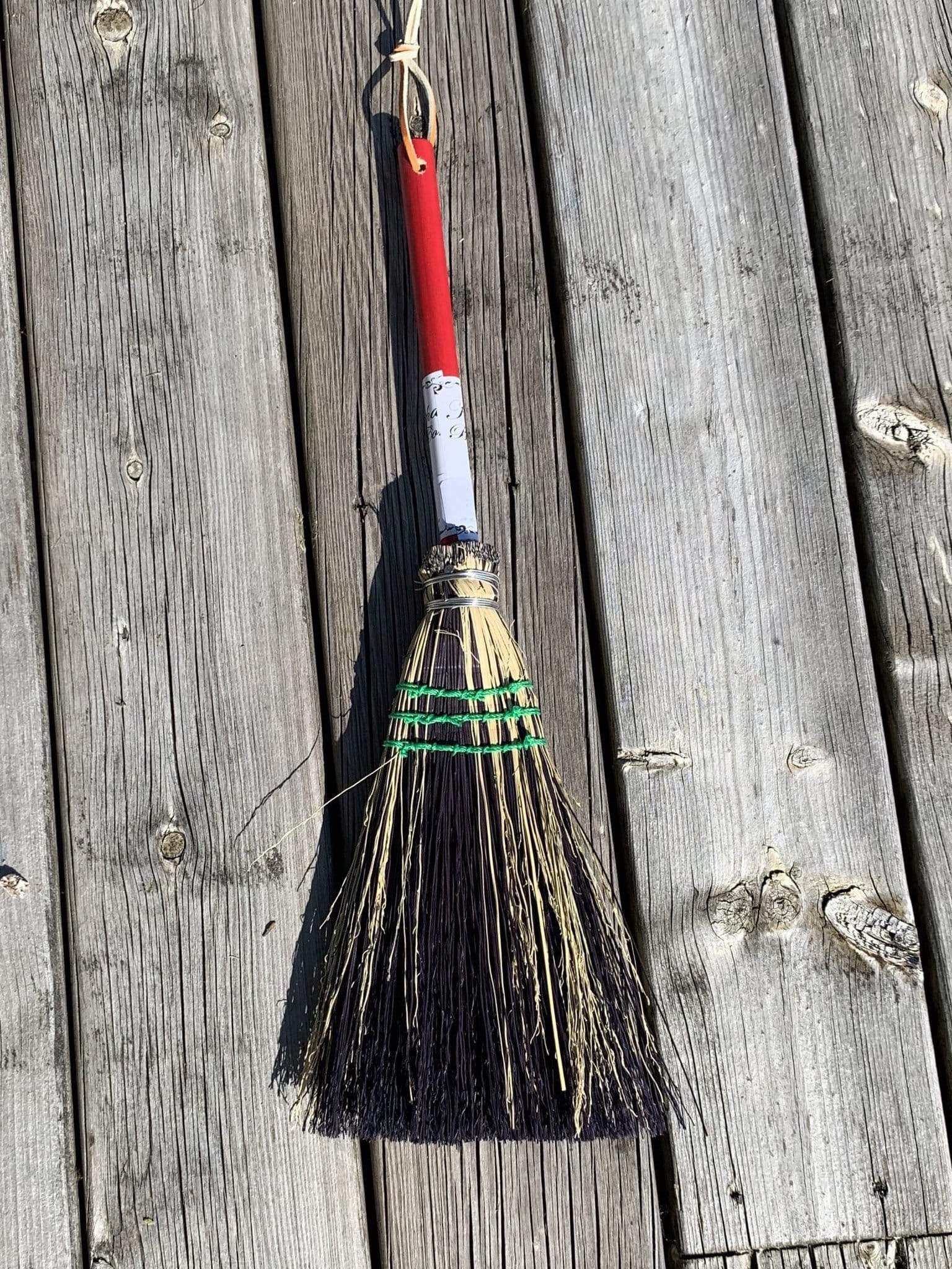 Whisk broom with handle and splash of black
