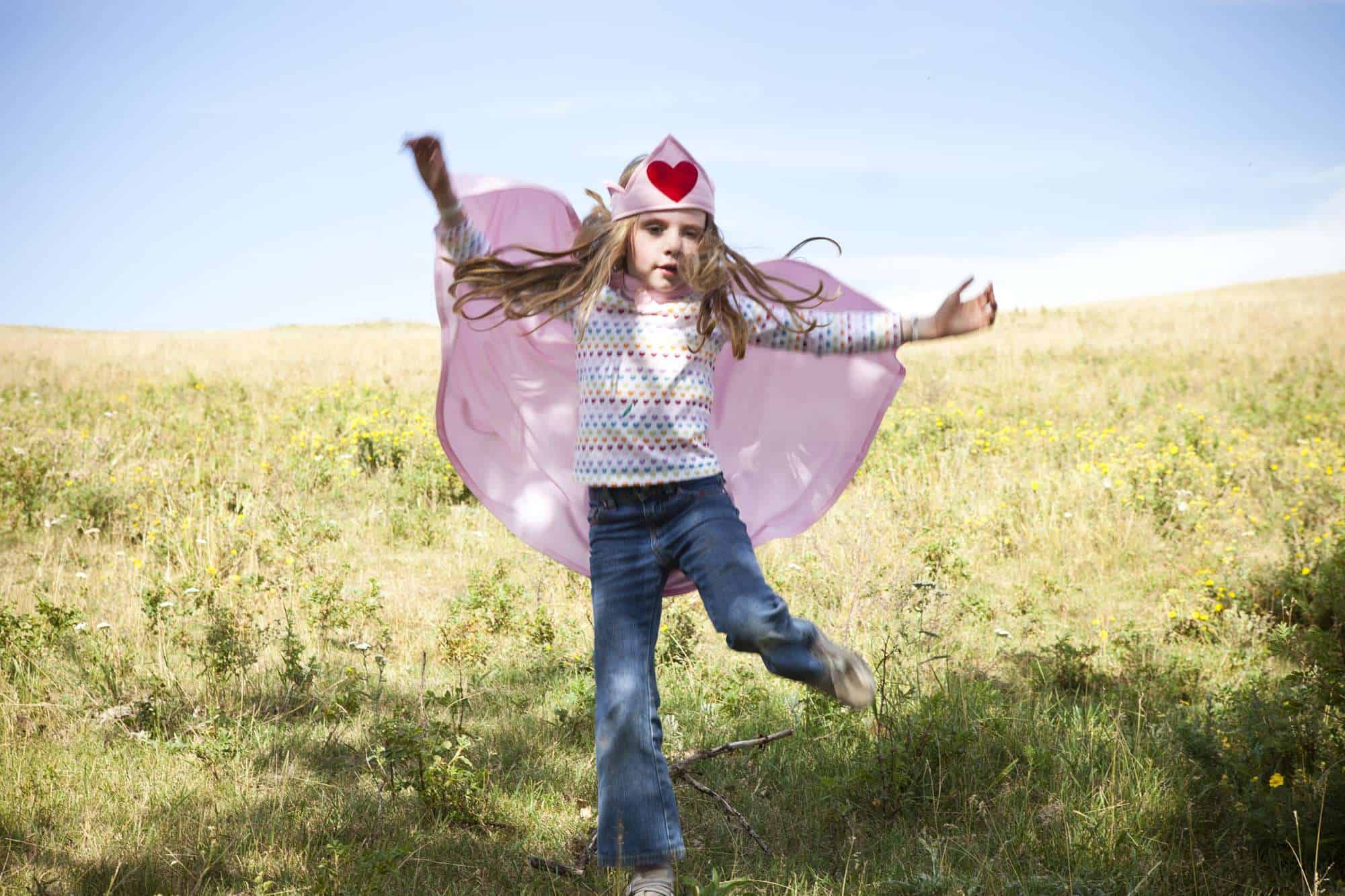 Classic Supercapes are made from light, breathable polyester, such as is used in sports jerseys. Scotchguarded for easy washing and can be dried in the dryer. Superloops at the wrists allow for improved 'flying fun' and breakaway velcro collar for safety. Size 2-3 fits up to small three year olds...but can certainly be worn as they get taller. Supercapes come in a reusable zipper pouch with a handle for storing your treasures. Pink Classic Supercape Size 2-3