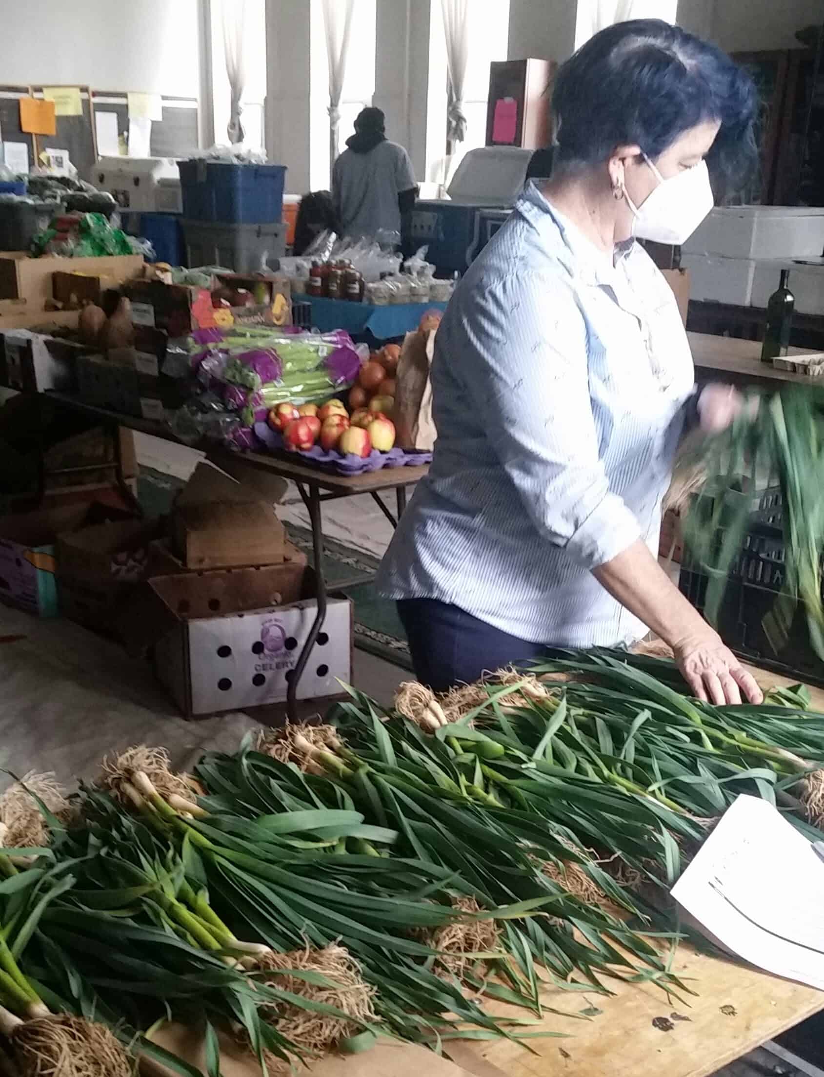Kristi in depot with green garlic