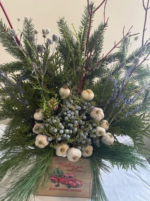 Garlic pine centrepiece a nice mix of our music garlic and farm evergreen w dry flowers, a conversation piece